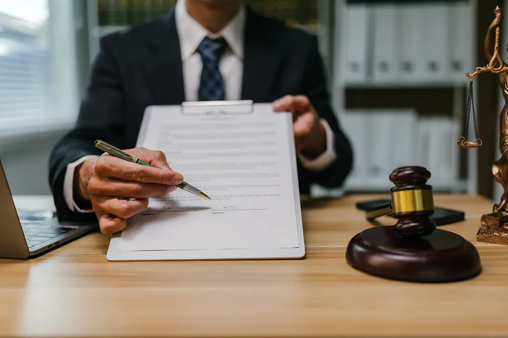 lawyer presenting legal document for signature